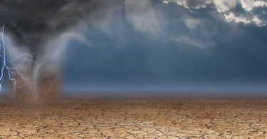 Desert with tornado and rain clouds