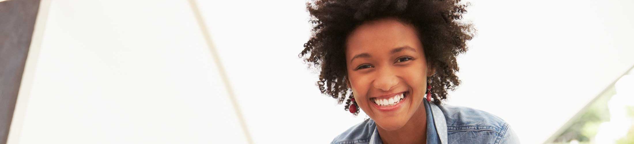 Black business woman smiling at work