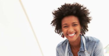 Black business woman smiling at work