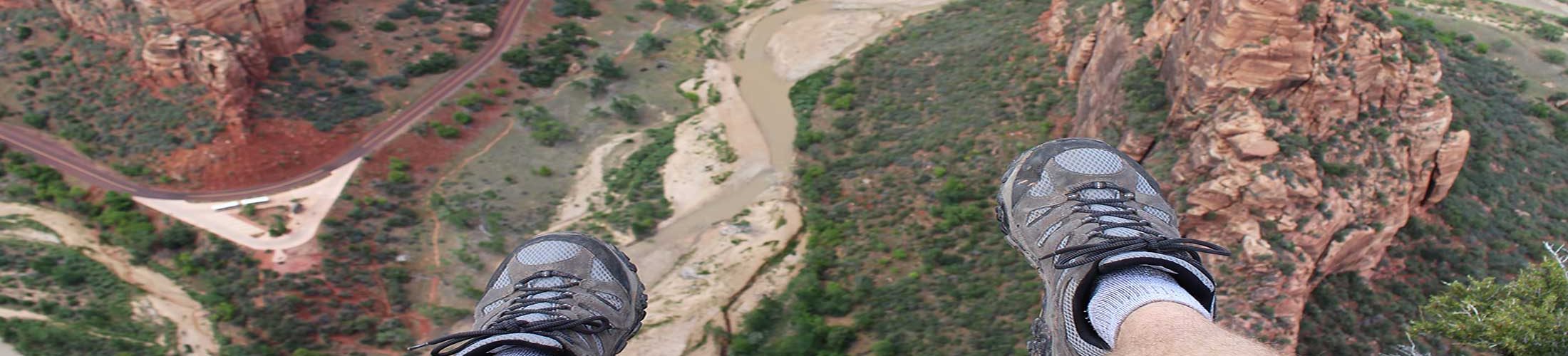 Man sitting above canyon