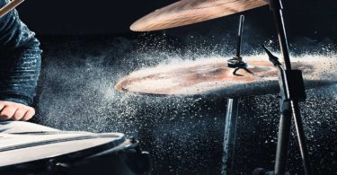 Man playing drums in rain