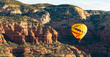 Hot air balloon over mountains