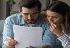 Couple looking at paper statement
