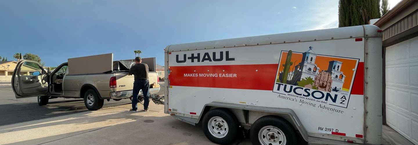 Man standing driveway moving truck