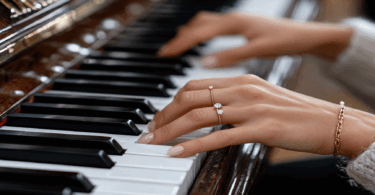 Female hands playing piano
