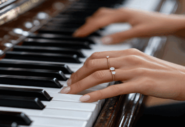 Female hands playing piano