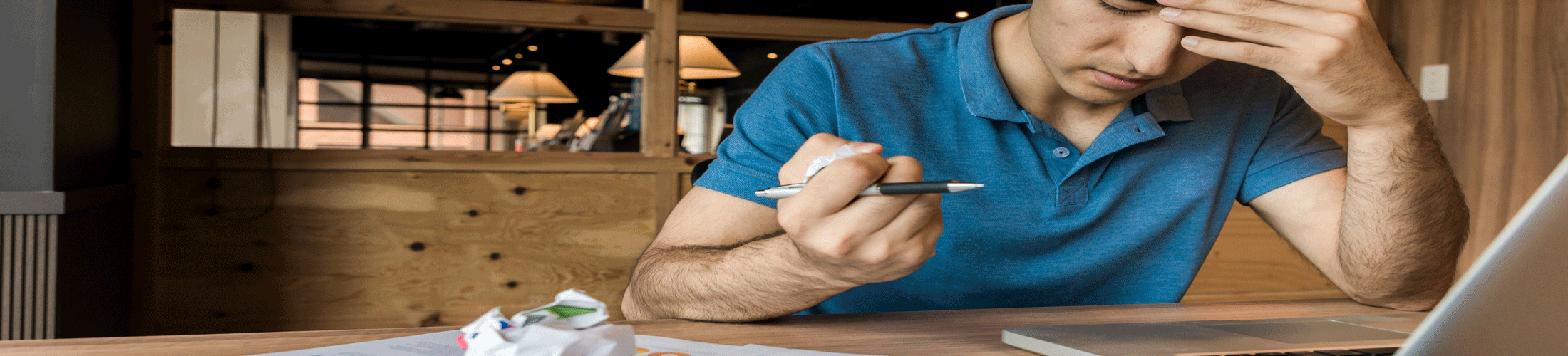 man slumped at desk