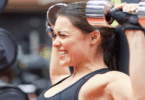 Woman lifting heavy weights